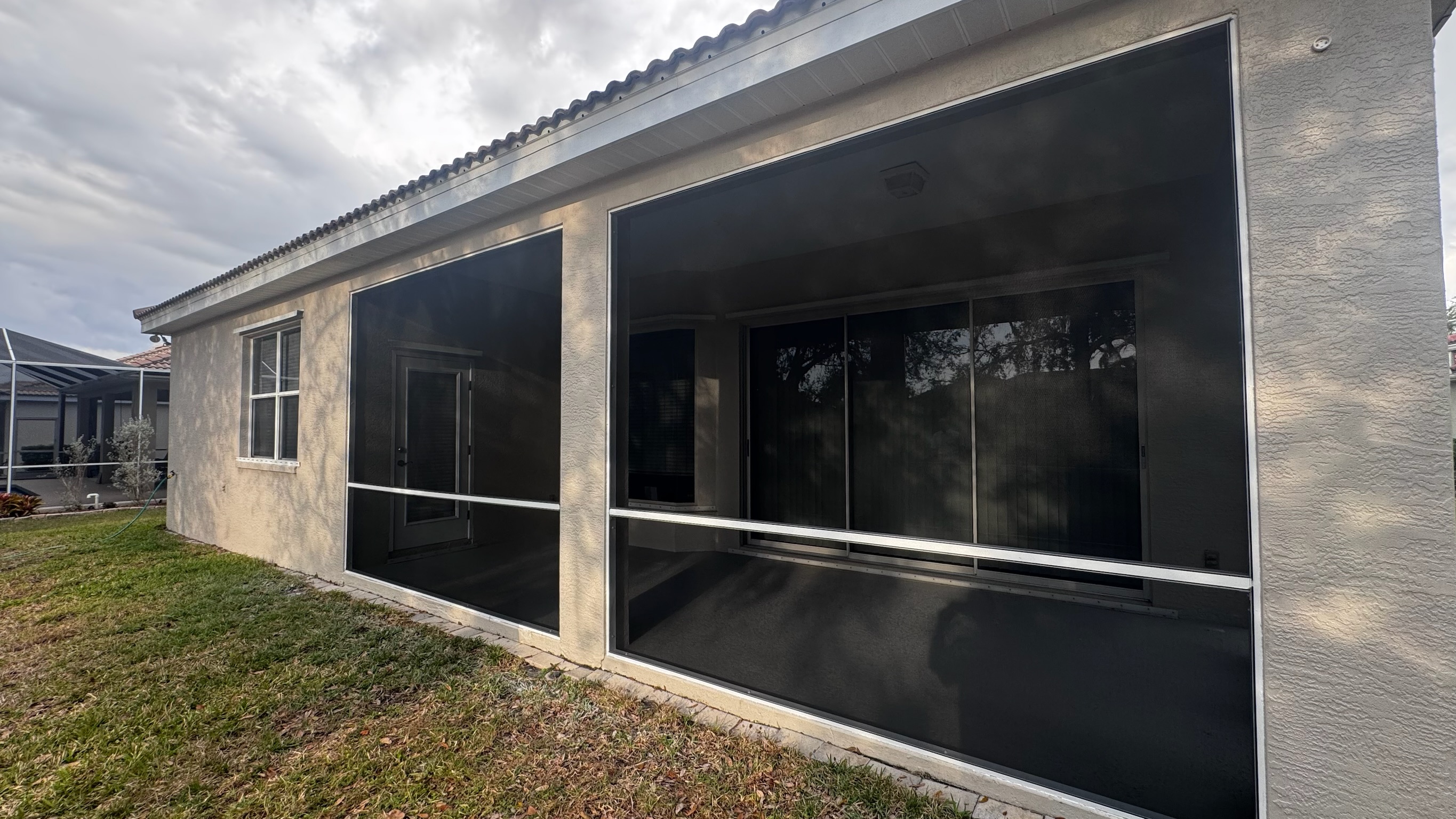 Custom aluminum screen enclosure with dark mesh screens