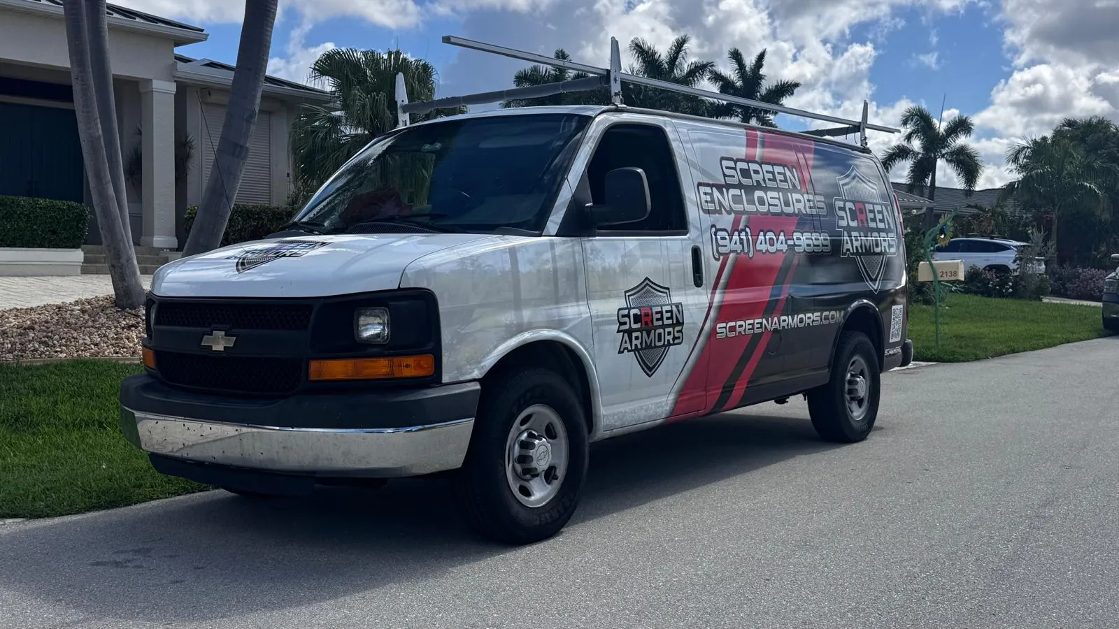 SCREEN ARMORS branded service van parked at a Florida home
